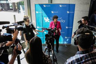 NIH Director Monica Bertagnolli talks with the press following her presentation.