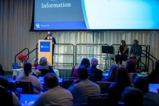 Nancy Harrington (Associate Dean for Research, College of Communication & Information) introduces her colleagues Sean Burns and Jennifer Scarduzio. 