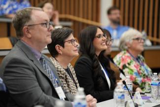 Symposium attendees listen to the panelists.