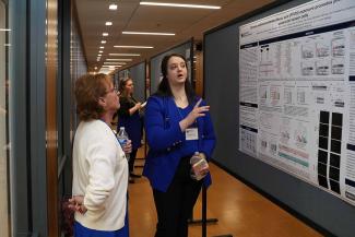 Symposium participants view trainee posters.