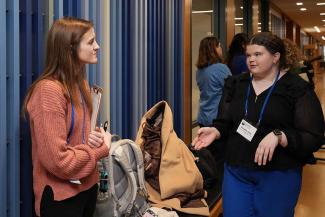 Symposium participants view trainee posters.