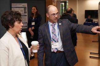 Symposium participants view trainee posters.