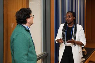 Symposium participants view trainee posters.