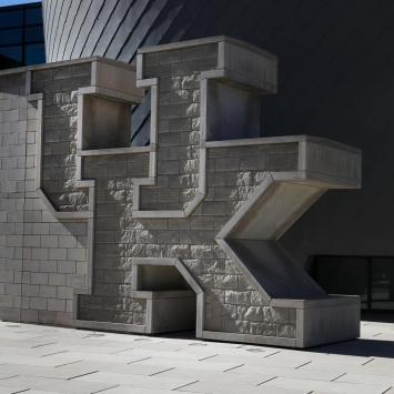 Photo of UK brick wall at the Gatton Student Center.